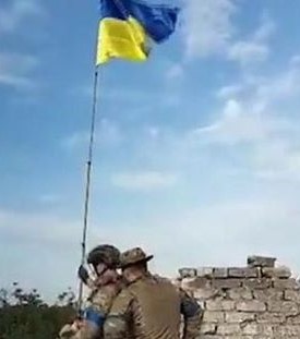 Ukraine offensive. Inside one of the villages freed from Russian forces. Ukrainian flag being raised in Neskuchne, Donetsk Oblast — BBC News.