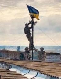 Ukraine says this shows its soldiers hoisting the flag over Vysokopillya, in the Kherson region, on Sunday — BBC News.
